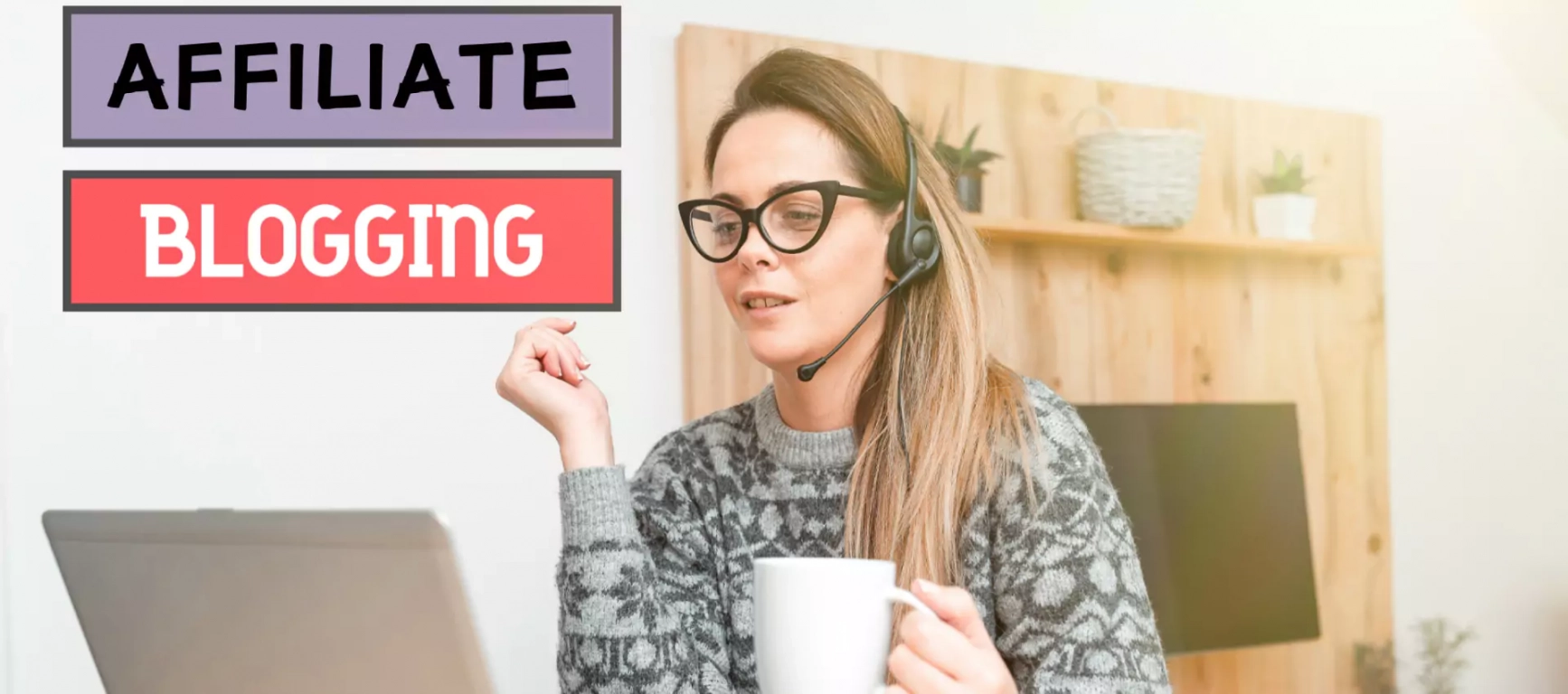 Woman with specs sitting in front of a laptop with coffee mug in hand
